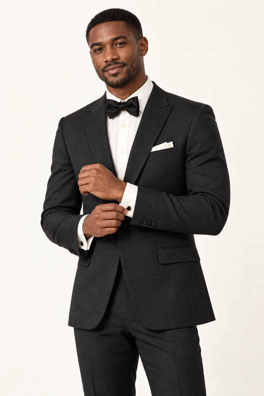 Conceptual model wearing a charcoal formal suit and accessories